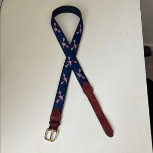 Stylish Navy and Red Men’s Belt with red white and blue lacrosse helmet and stix